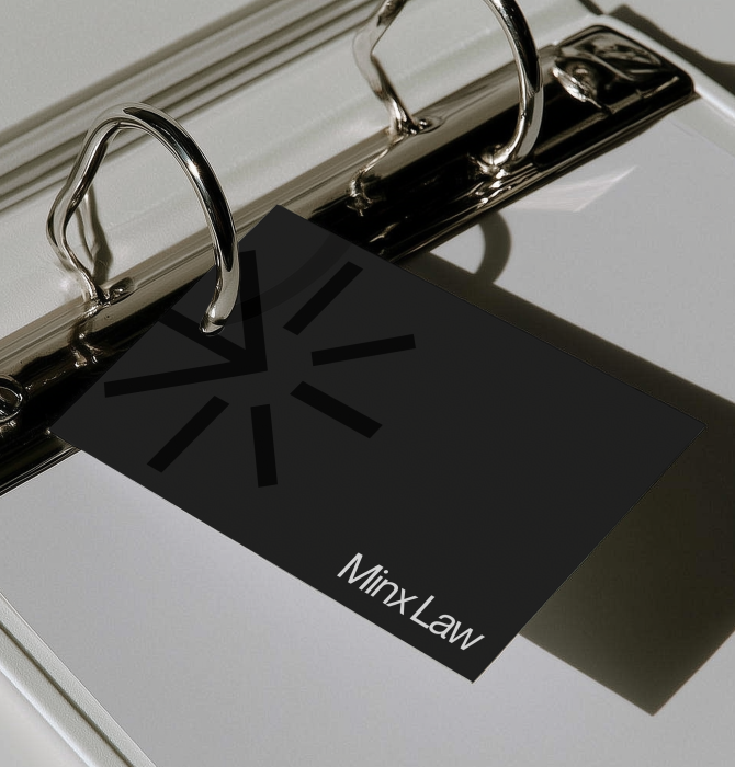 Minx Law brand card in a metal ring binder