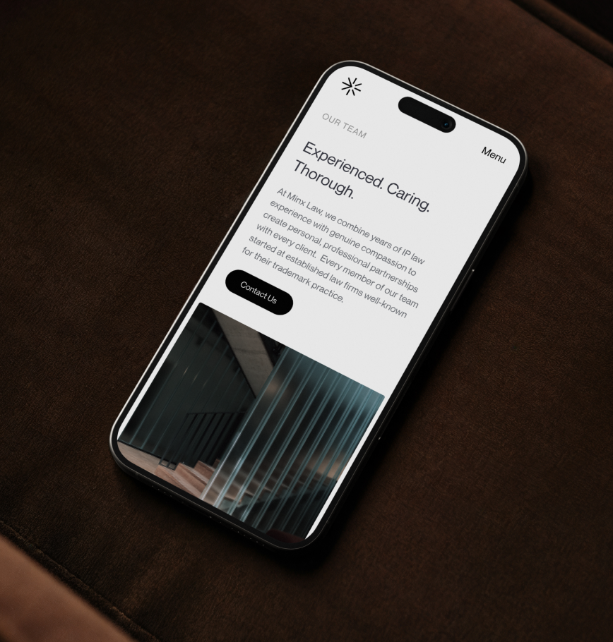 Minx Law website displayed on a phone