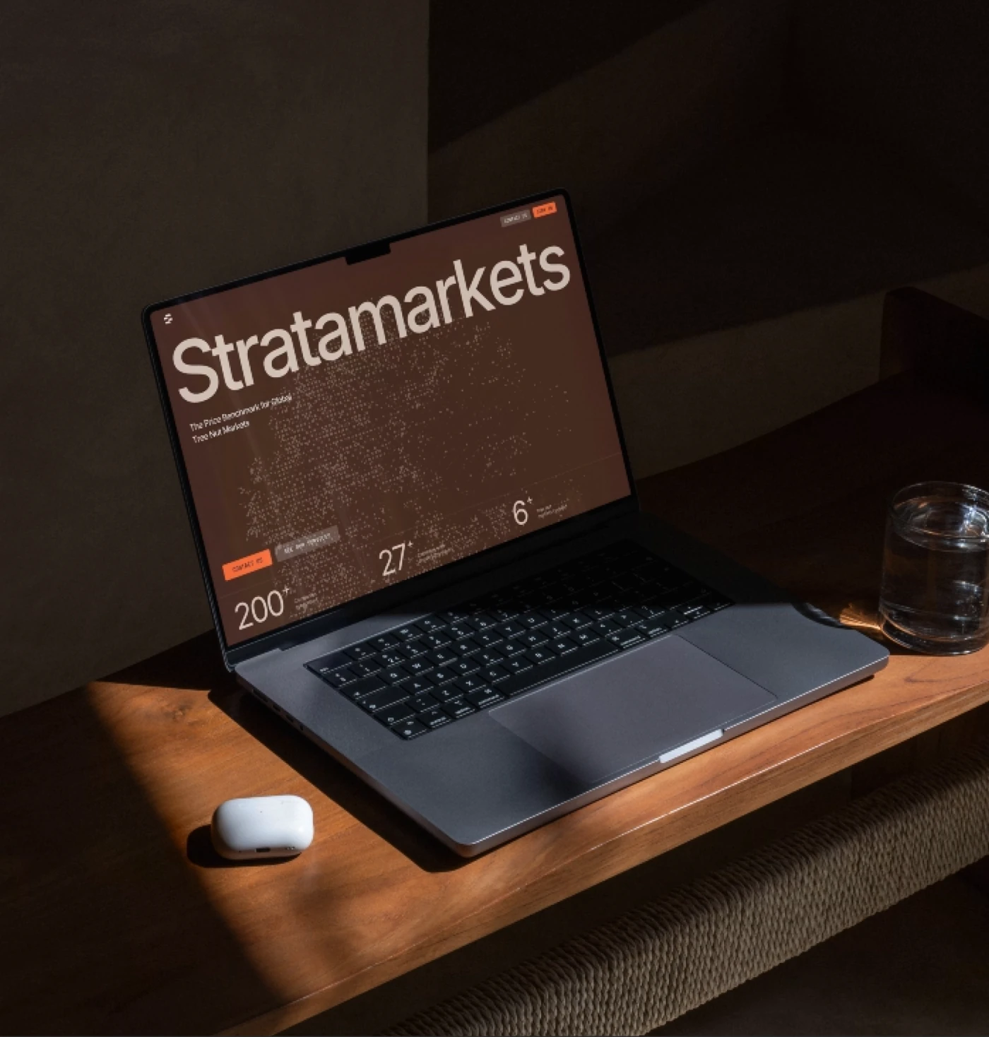 Stratamarkets website displayed on a laptop